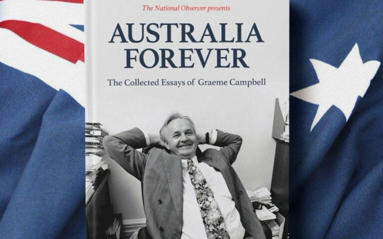 Book cover: Australia Forever—The Collected Essays of Graeme Campbell, with a smiling man in a suit relaxing in an office chair beside piles of papers and flags on both sides.