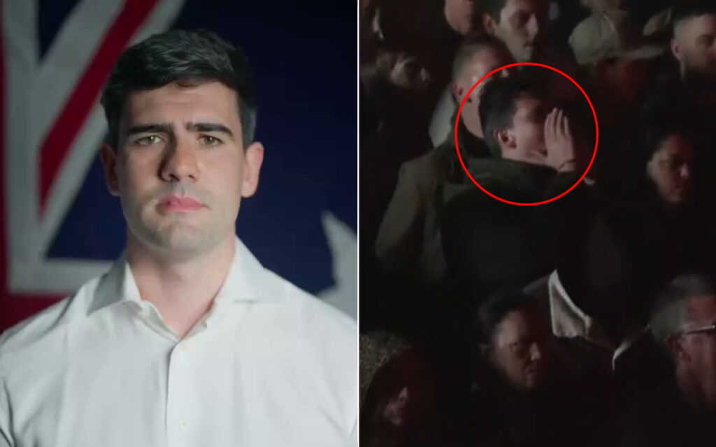 Portrait of a man in a white shirt with a flag background, looking straight at the camera (informative headshot).