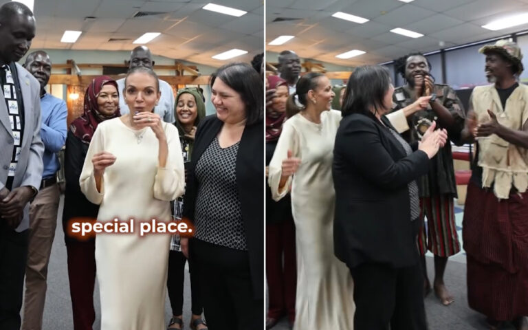 Diverse group of people indoors, smiling and clapping in a celebration; words 'special place' overlaid in the foreground.