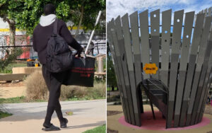 Person walking away outdoors with a black backpack and a black tote bag featuring red text, in a park setting (avoids identifying the individual).] ,