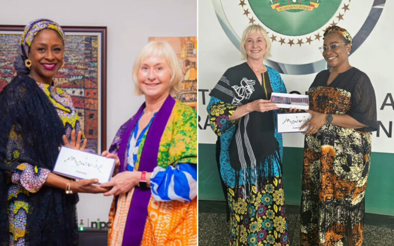 Two women in colorful African print outfits exchange a certificate and smile at a photography setting indoors (left image).