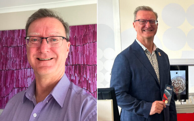 Two photos of a middle-aged man with glasses: left, wearing a light purple shirt in front of a pink abstract background; right, in a blue blazer at a display holding a card and smiling.