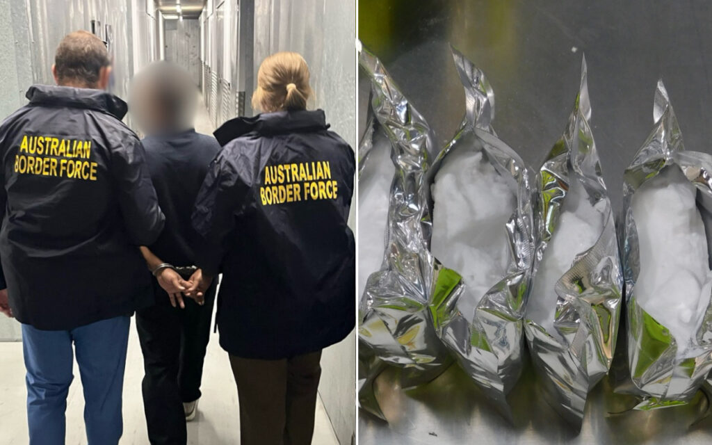 Two Australian Border Force officers escort a detainee down a hallway, jackets reading AUSTRALIAN BORDER FORCE, detainee in custody.