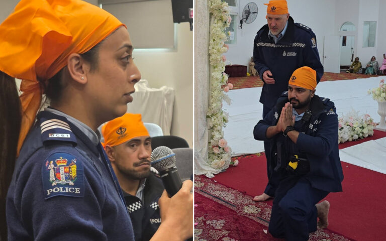 Two police officers at a ceremony: on the left, a female officer in profile with an orange headscarf; on the right, a male officer kneeling in prayer with hands together, another officer behind him.