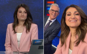 Split-screen of a female news anchor in a pink blazer at a desk on the left, with a laptop displaying 'Australia Votes', and a smiling woman in pink blazer with a man in a suit in the studio on the right.
