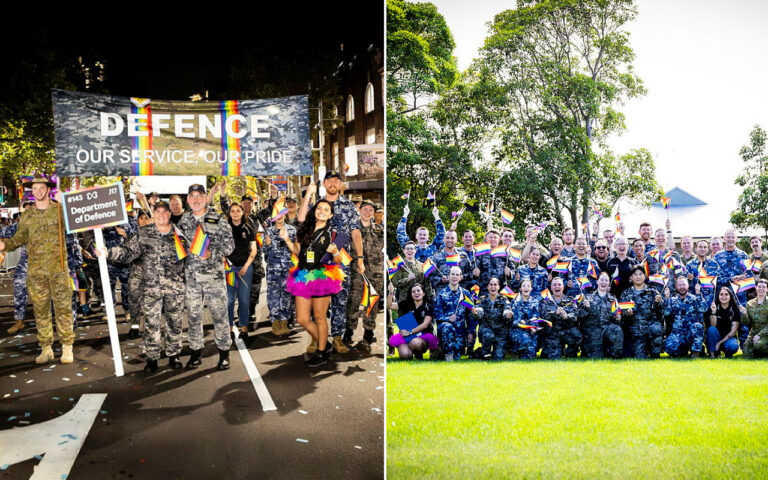 Military personnel at a Pride parade under a DEFENCE banner, waving rainbow flags and smiling.