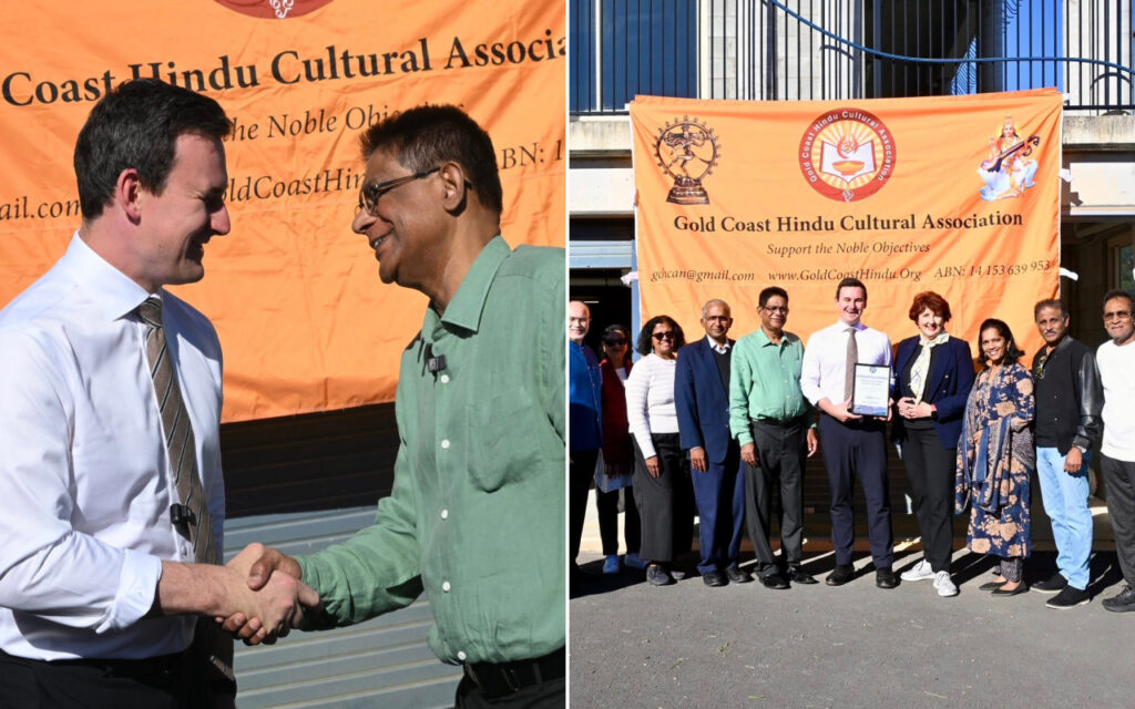Group photo in front of an orange Gold Coast Hindu Cultural Association banner; two men shake hands while others pose, one holding a certificate.