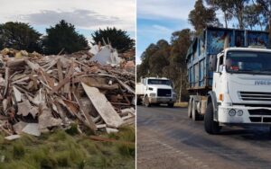 Left: large pile of construction debris and wood rubble with grass in the foreground; right: white dump truck on a road with a blue trailer and a second truck in the distance.