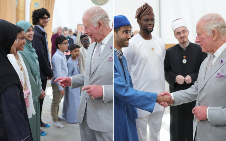 Older man in a light gray suit greets a diverse line of youths during a ceremonial handshake.