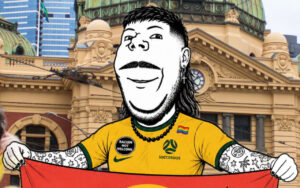 Cartoon man in a yellow Socceroos jersey holds a red banner in front of a historic city building.
