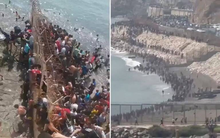 Two-panel scene: a dense crowd gathers along a barbed-wire barrier at the edge of the sea, many people pressed against it as waves lap nearby.