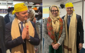 Left: man in a suit with a beige scarf and yellow head wrap, hands pressed in prayer; right: man and woman in business attire wearing yellow head coverings and beige scarves, smiling for the camera.