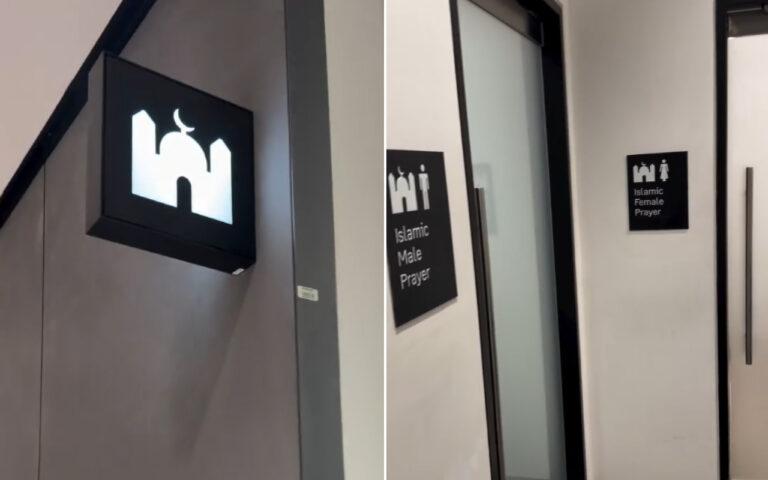Sign with mosque icon on wall near a doorway, indicating prayer area location (informational)